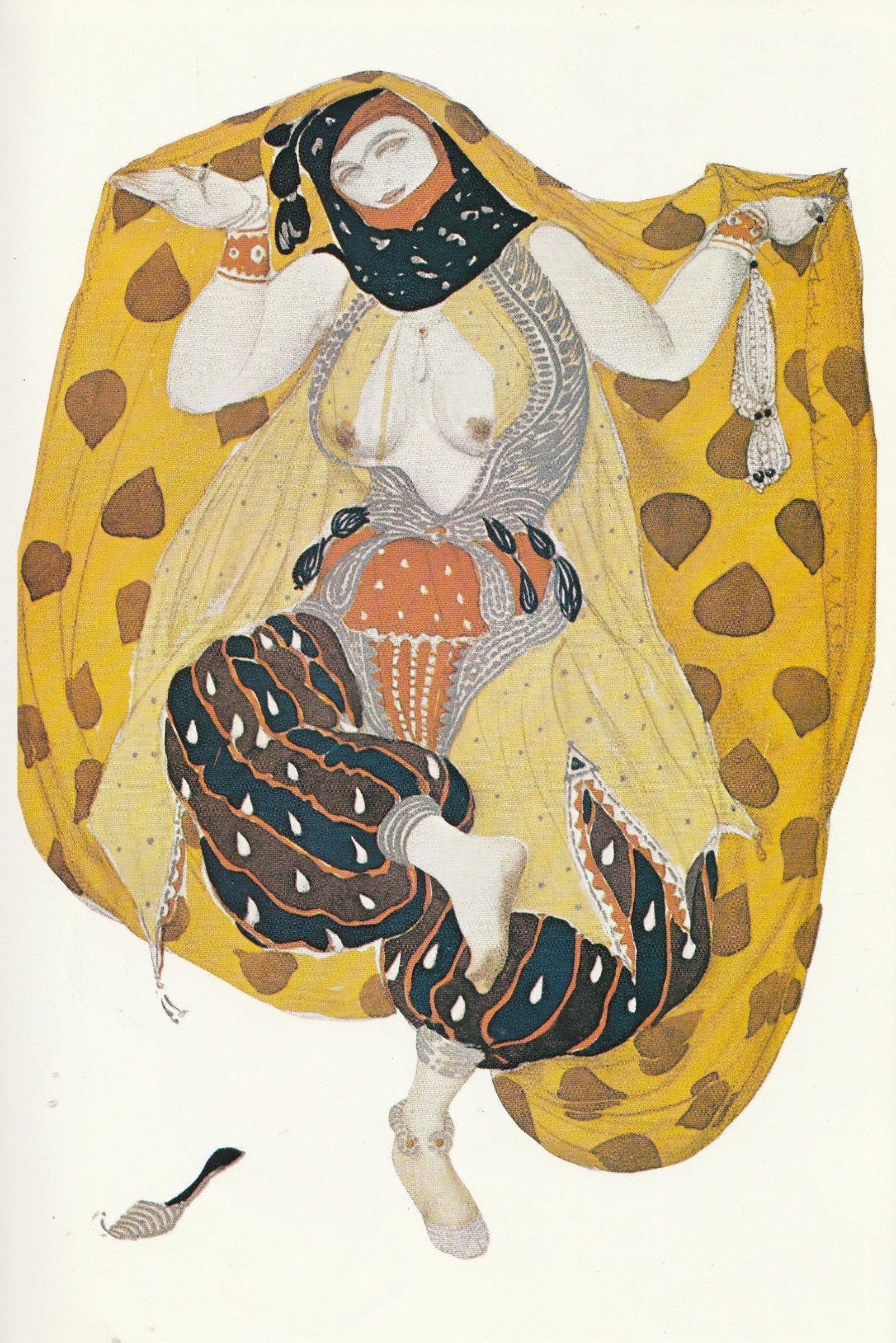 A pale-skinned female dancer in an ornate Orientalist costume holds aloft a billowing golden fabric patterned with brown leaves.