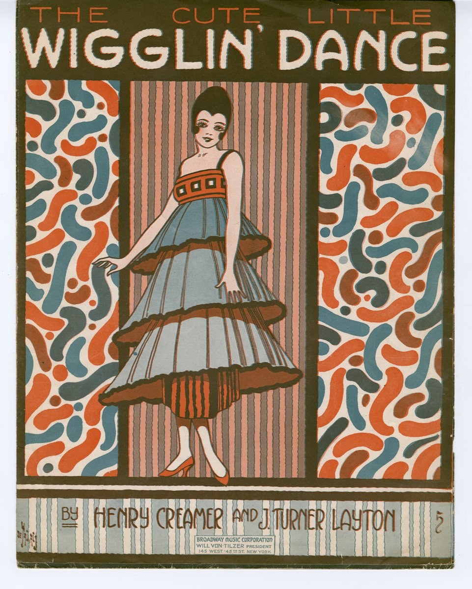 Sheet music cover showing a woman in a pale blue dress with brown trim, posed mid-dance against geometric Art Deco patterns in rust and teal.
