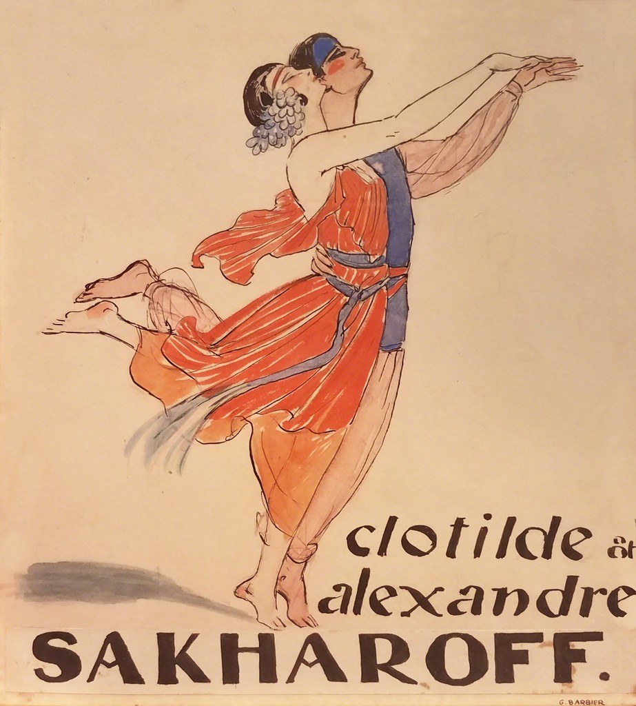 A woman arches backward in her partner's arms, wearing a flowing red dress and blue headwrap, both dancers reaching upward against a cream background.