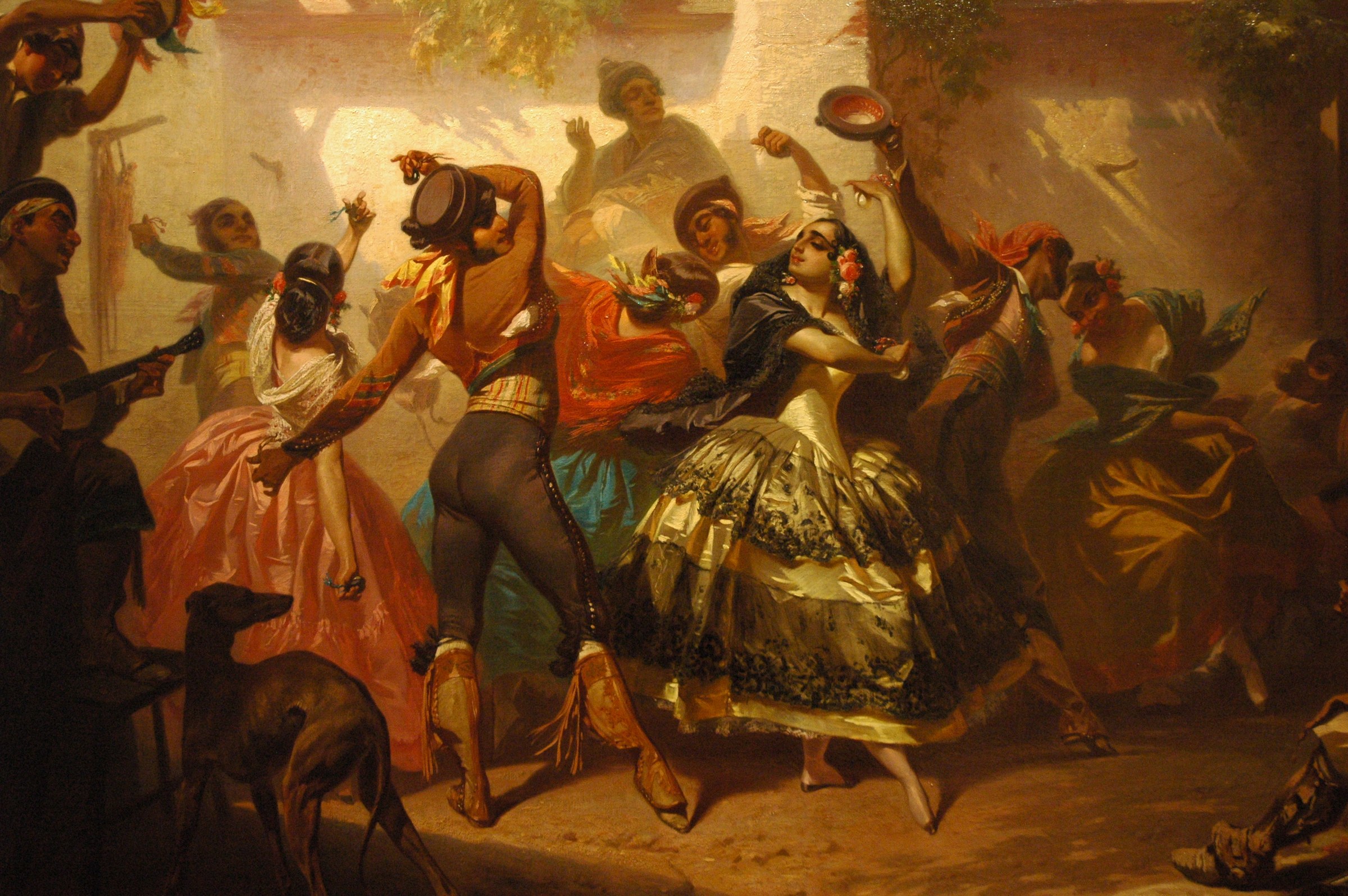 Spanish inn scene with multiple dancers in period dress: woman in orange twisting mid-dance, surrounded by clapping men in dark jackets, golden light and