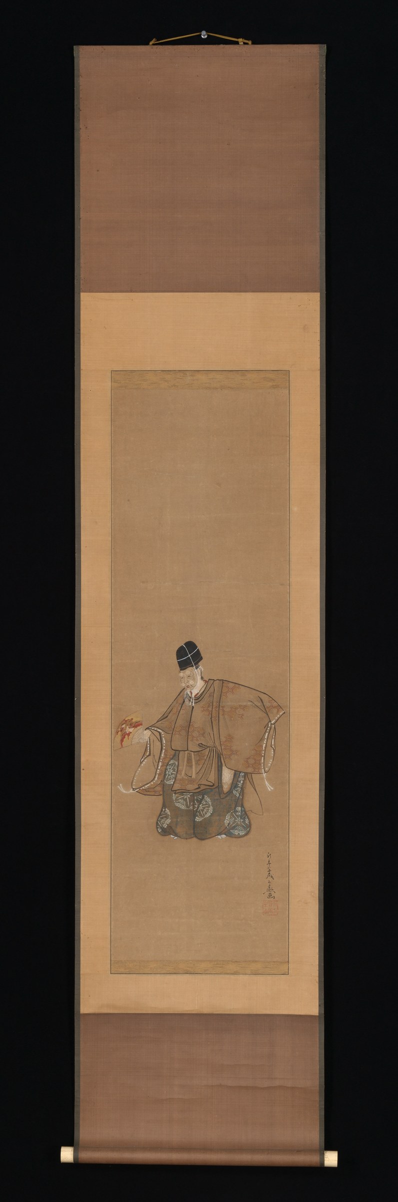 Ink and watercolour figure on silk scroll: a single dancer in patterned brown robes, head covered, bent deeply forward at the waist with one arm extended and
