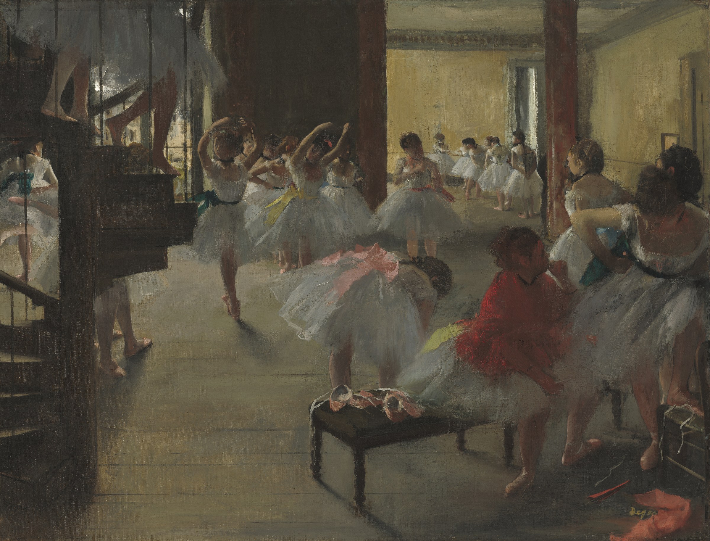 Ballet dancers in white tutus practice at a studio; one woman in red sits watching. Pointe shoes litter the floor.