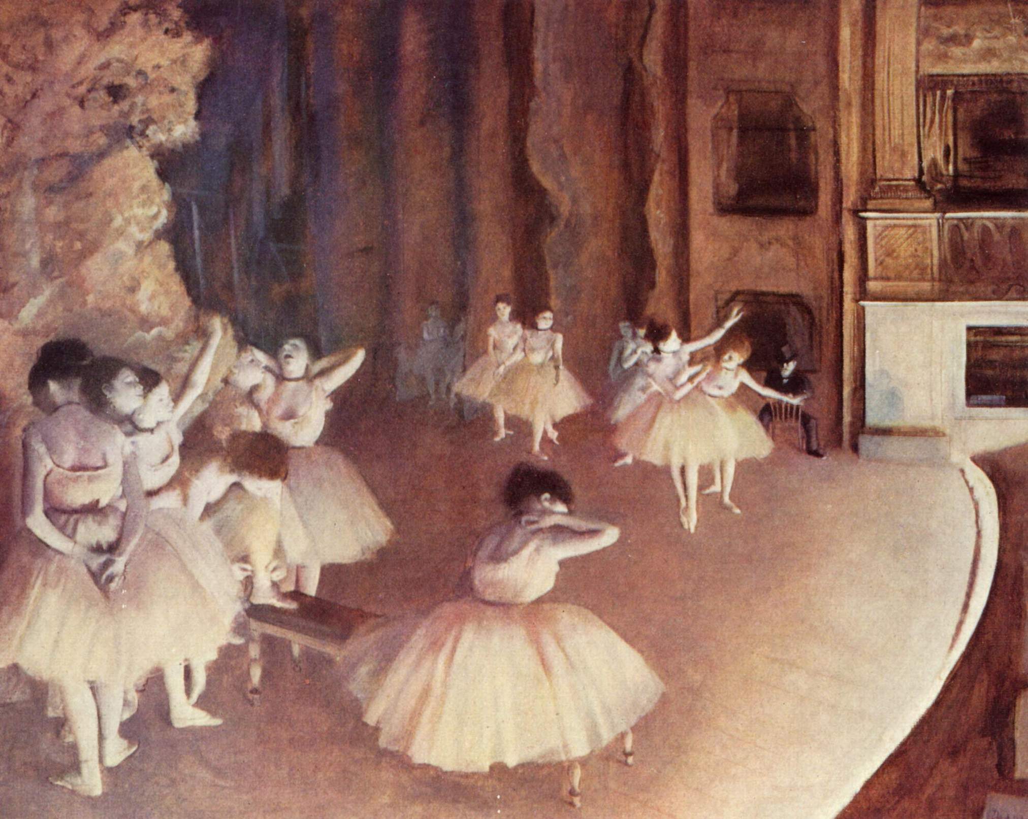 A dozen young ballet dancers in a sunlit studio, some exercising, others waiting or resting, wearing pale practice skirts and classical positions.