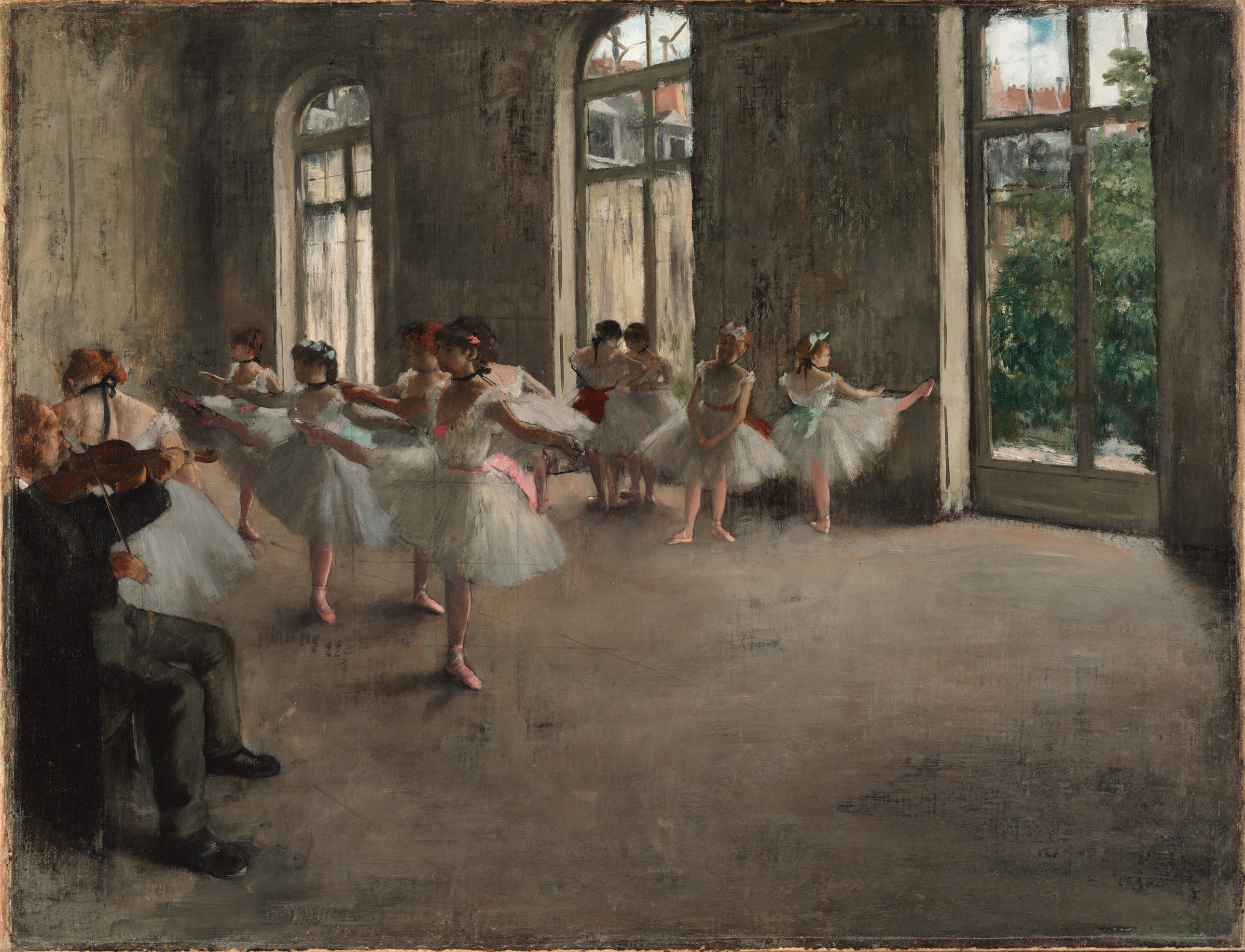 Eight female ballet dancers in white tutus rehearse in a large studio with tall windows, accompanied by a seated violinist.