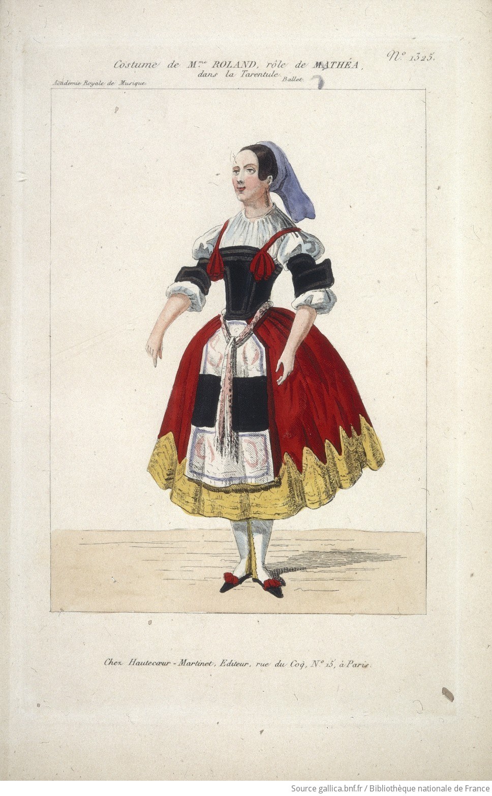 Standing female dancer in black bodice, white chemise, and red wool skirt with gold scalloped hem, blue headcloth, red heels, facing left.
