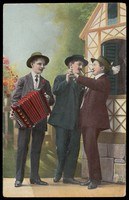 Three men in early 1900s dress: two in dark suits dancing face-to-face in a formal ballroom frame, one in a light jacket playing an accordion.