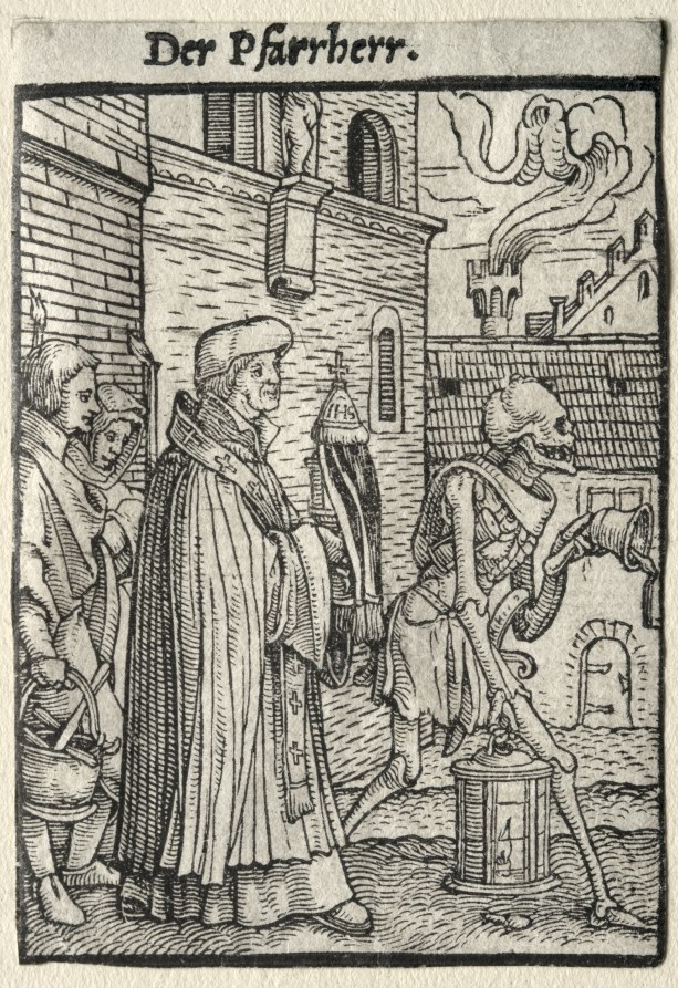 A robed pastor stands in a medieval town square attended by a woman and child, while skeletal and demonic figures swirl above the roofline.