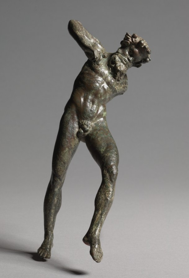 Bronze statuette of a bearded male satyr figure in dynamic, arched pose with head thrown back and arms raised.