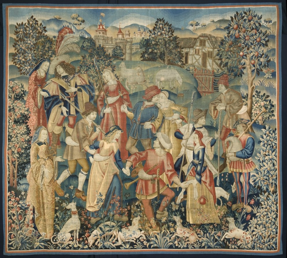 Medieval round dance in a walled garden, with richly dressed figures holding hands in a circle as musicians play.