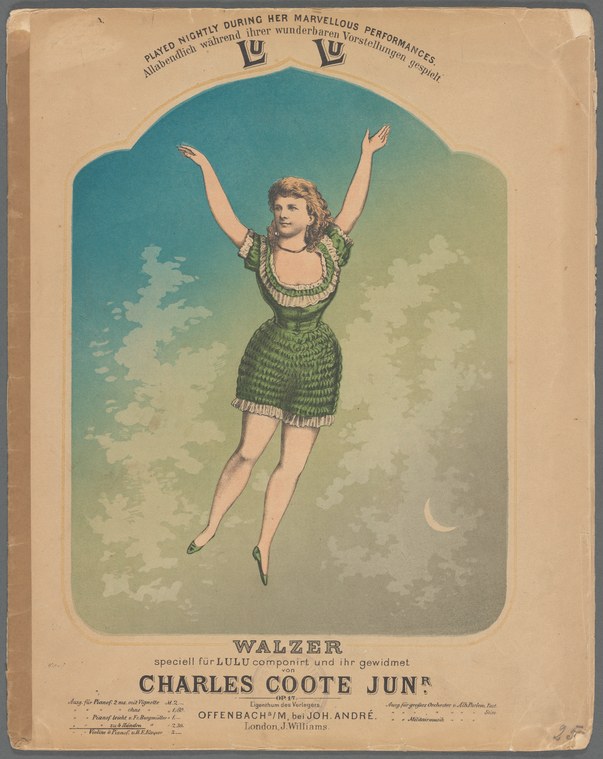 A young woman in a green beaded dress with blonde waves floats horizontally against a soft sky, arms raised, suspended in mid-air.