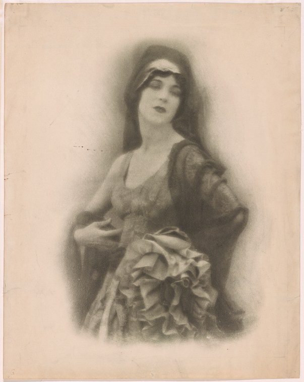A woman in a long draped theatrical costume with puffed sleeves gazes upward, posed against a soft, fading background.