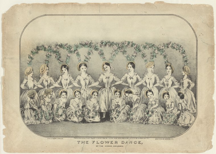 Two rows of young dancers in white dresses with flowers, arranged symmetrically beneath a floral garland, posing for a formal theatrical print.