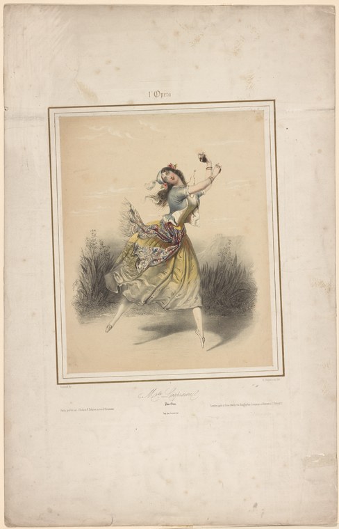 A young female ballet dancer in a pale yellow dress and gold-patterned bodice performs a classical pose with one leg extended high, arms raised, against a pale