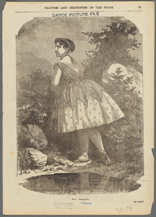 Woman in 1840s ballet costume stands beside a woodland stream, turning to glance back over her shoulder.