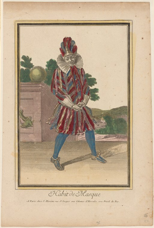 A man in striped red and blue theatrical costume with tall feathered headdress stands with legs apart, hands at rest, facing forward.