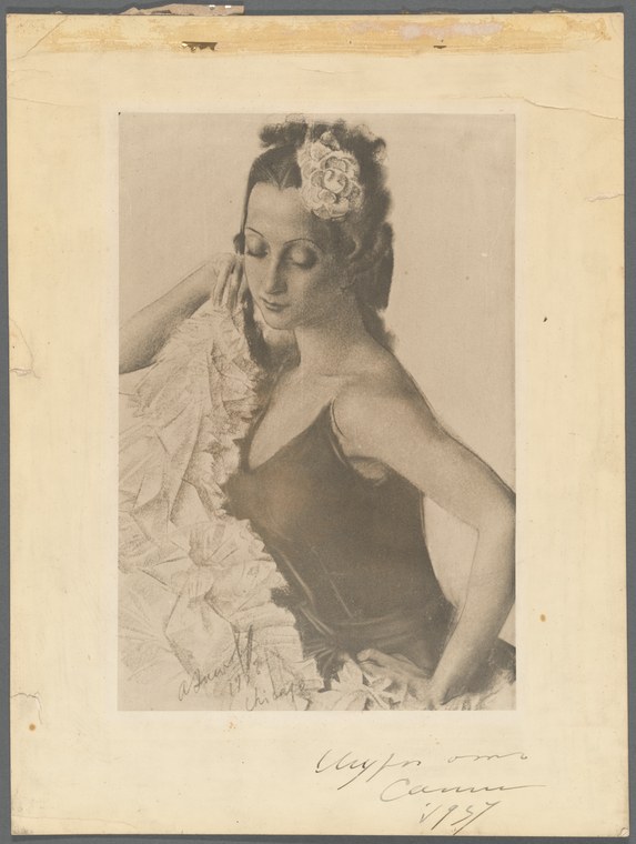 A woman in a dark sleeveless dance costume stands in three-quarter view, her head tilted left with hand raised to her face, wearing a flower in her hair and a