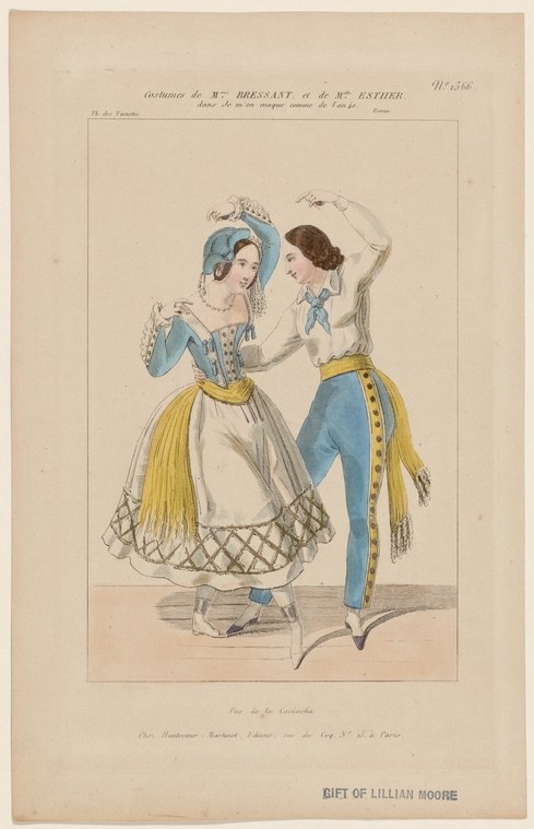 Two women in pale blue jackets and white gathered skirts with gold trim face each other in an animated theatrical pose.