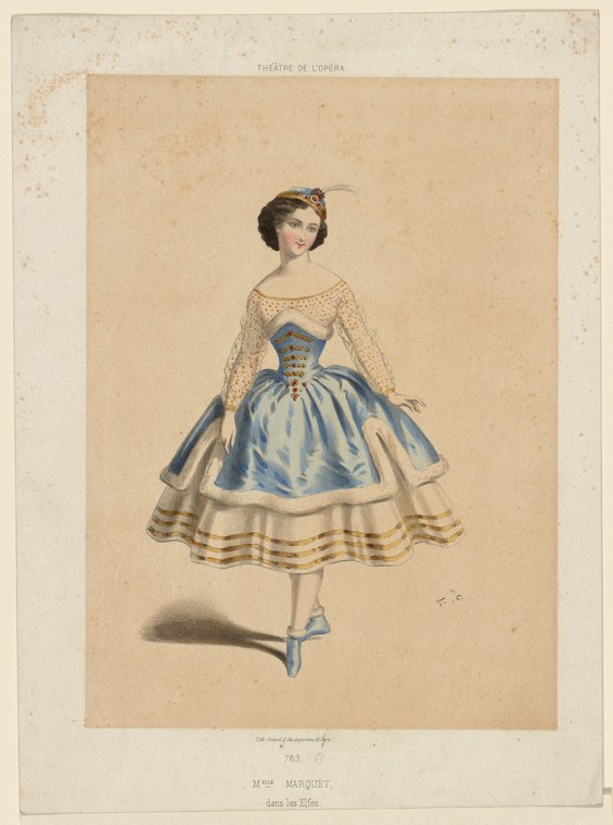 Woman in 19th-century ballet costume with blue skirt, lace sleeves, and feathered headdress standing in poised position