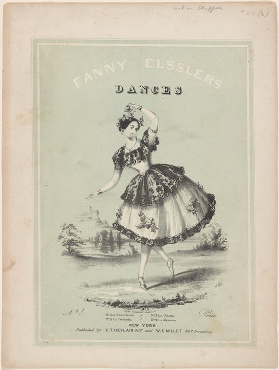 Female ballet dancer in white tulle skirt and dark bodice, posed en relevé with raised arm, against pale green background.