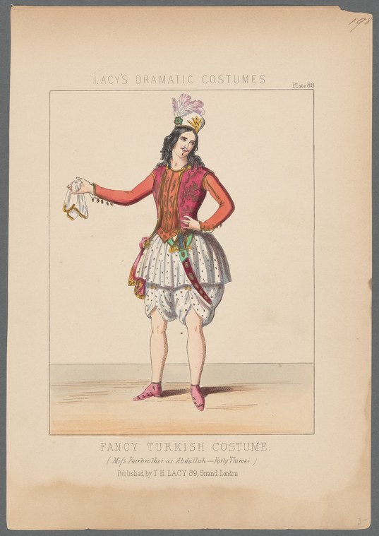 A woman in elaborate Ottoman-inspired theatrical costume strikes a confident pose holding an ornament aloft.