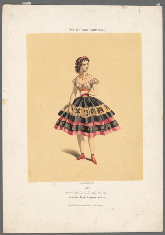 Young woman in 1890s theatrical costume with tiered skirt featuring decorative patterned bands and pink trim, standing in relaxed ballet pose.