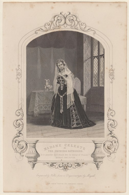 A woman in an elaborate dark velvet gown with gold embroidery and white veil stands in an ornate interior, posed formally and gazing outward.