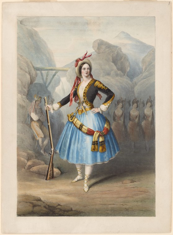 A young woman in romantic ballet costume holds a rifle in a mountainous landscape, poised on one leg in a balletic attitude.