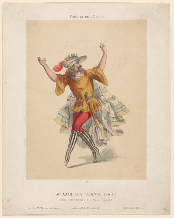 Male dancer in puffed-sleeve golden jacket and gauze overskirt leaping with arms raised, wearing a crowned hat and striped stockings.