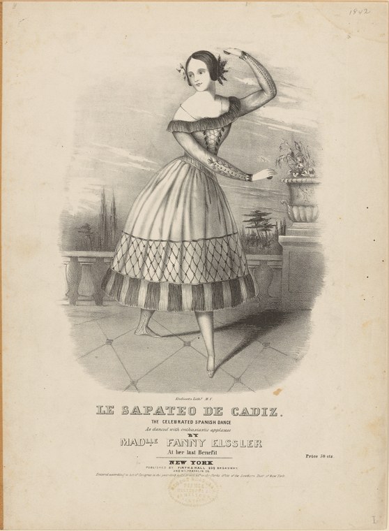 A young woman in a pale silk skirt with geometric patterning stands poised mid-dance, one arm raised behind her head, in a classical interior.