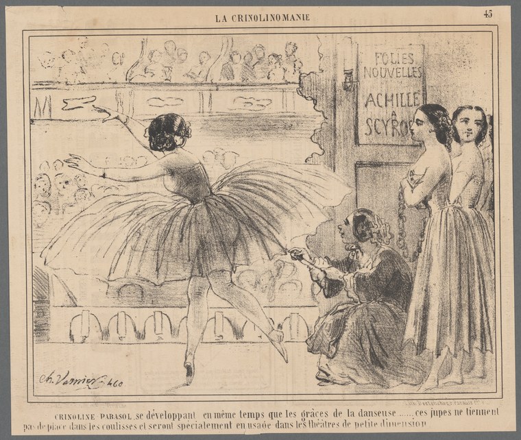 A woman in a voluminous tulle skirt arches backward in an acrobatic flex while two onlookers watch from the side.