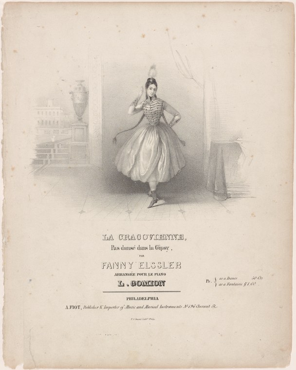 A woman in a pale tulle skirt and corseted bodice stands in a ballet pose in a theatrical interior, wearing a feathered headdress.