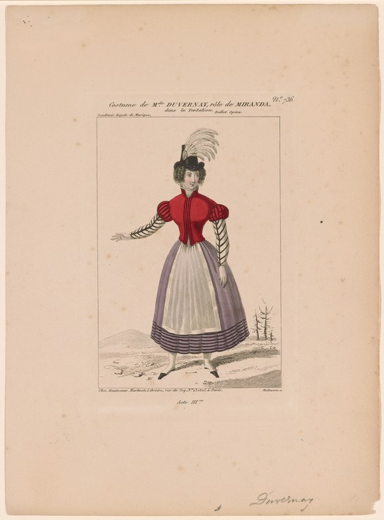 Woman in red bodice and lavender pleated skirt with white feathered headdress, standing in formal balletic pose against plain background.