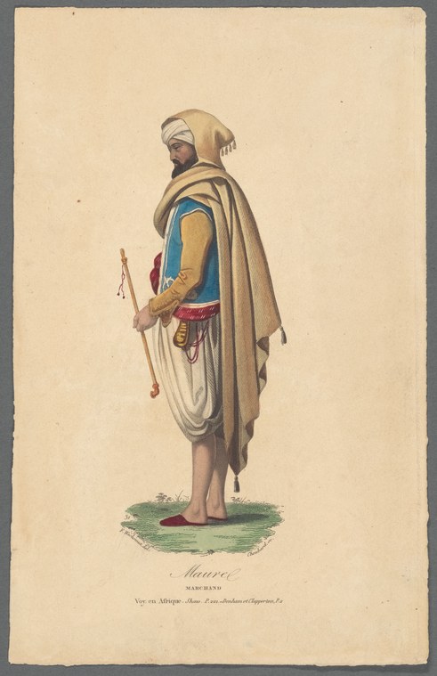 A barefoot man in white head wrapping, blue tunic, and crimson wrap stands facing three-quarter view, holding a staff, one arm raised.