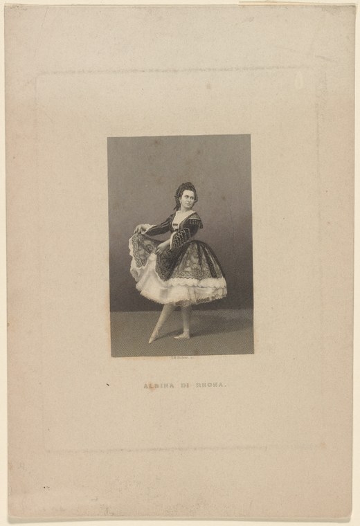 A young woman in Romantic-era ballet costume—black bodice, white ruffled skirt—stands with raised arm holding patterned fabric in a studio portrait.