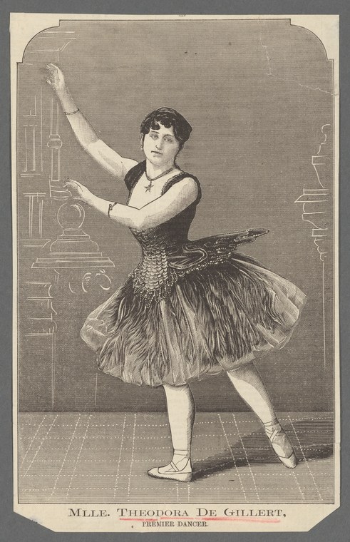 A young female ballet dancer stands en relevé in a dark bodice and voluminous tulle skirt, arms raised in a graceful pose.