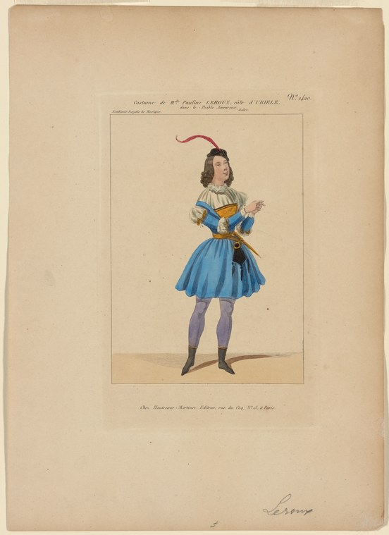 A young female ballet dancer in a blue tulle skirt and blue bodice with white collar stands in an elegant pose, a red feathered plume in her hair.