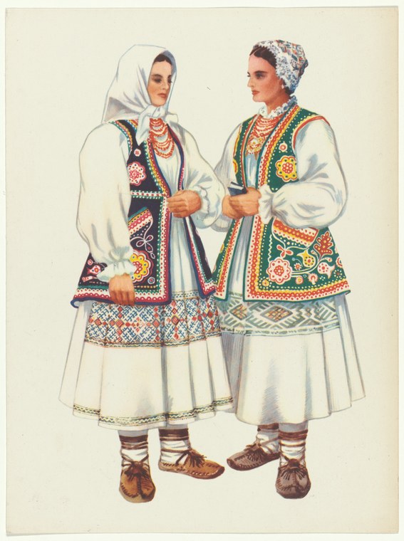 Two women in contrasting regional Yugoslav folk costumes with embroidered vests, white linen shifts, and headscarves stand facing each other.
