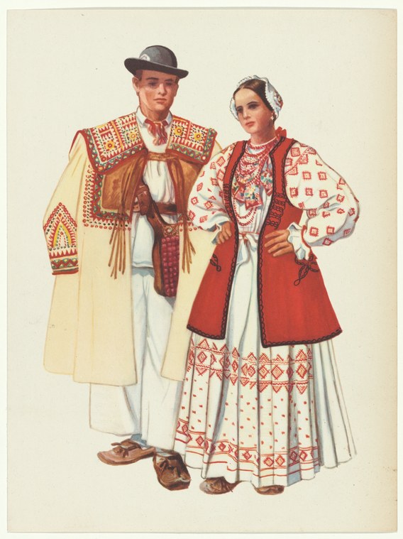 Man and woman in traditional Yugoslav embroidered costume standing in formal pose against plain background.