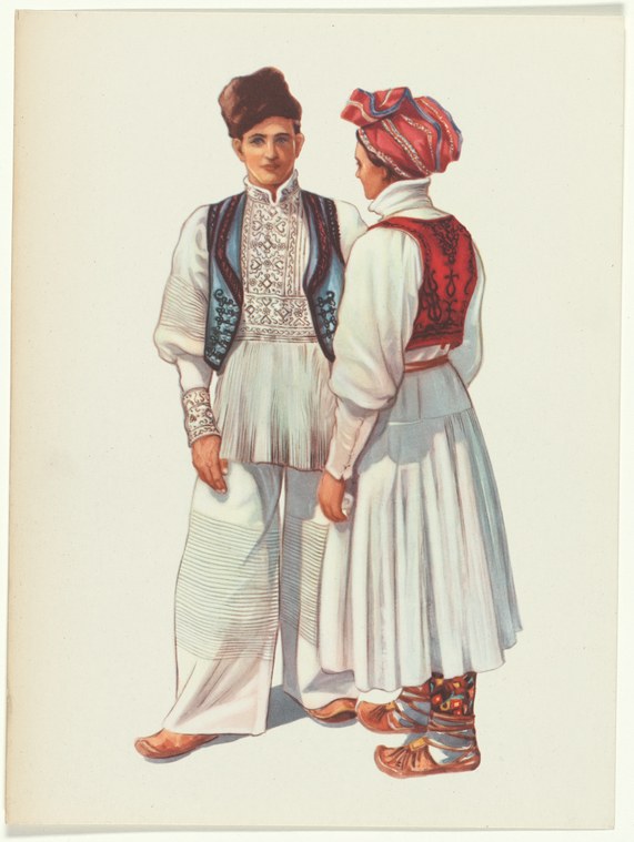 Two figures in traditional embroidered Yugoslav dress stand formally against a plain background: one facing forward in a dark blue vest, the other from behind