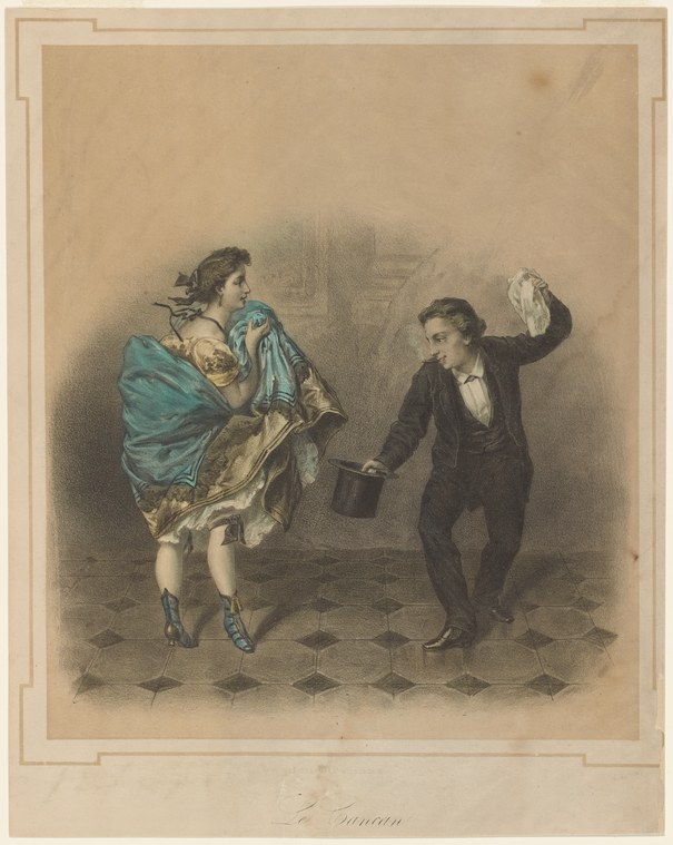 A woman in a teal wrap and gold dress executes a high kick while a man in formal dress watches, on a tiled floor.