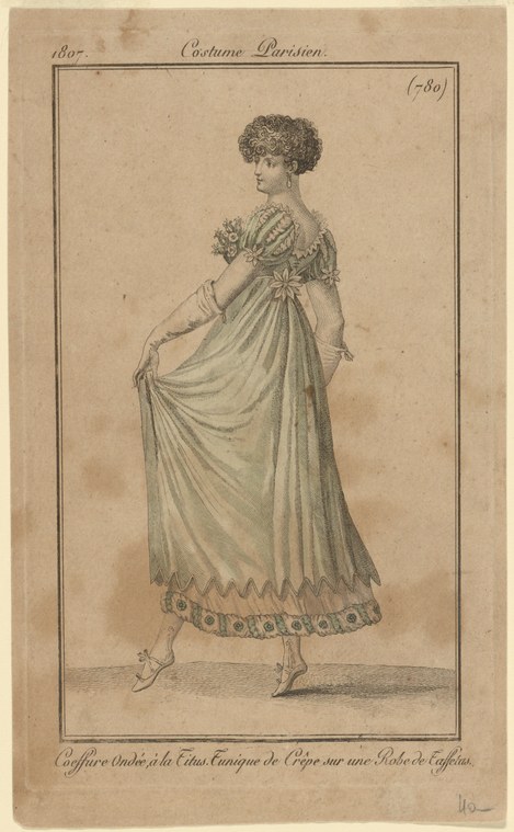 Engraving of a woman in a high-waisted empire-line muslin gown with a Titus crop hairstyle, standing still with flowers.