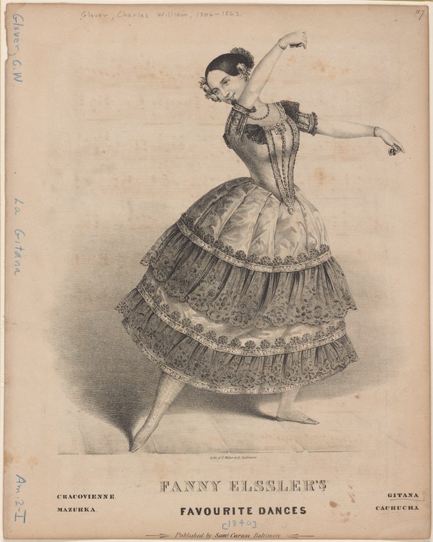 Woman in corseted bodice and tiered, embroidered skirt, posed in balletic stance with arms extended, looking to the side.