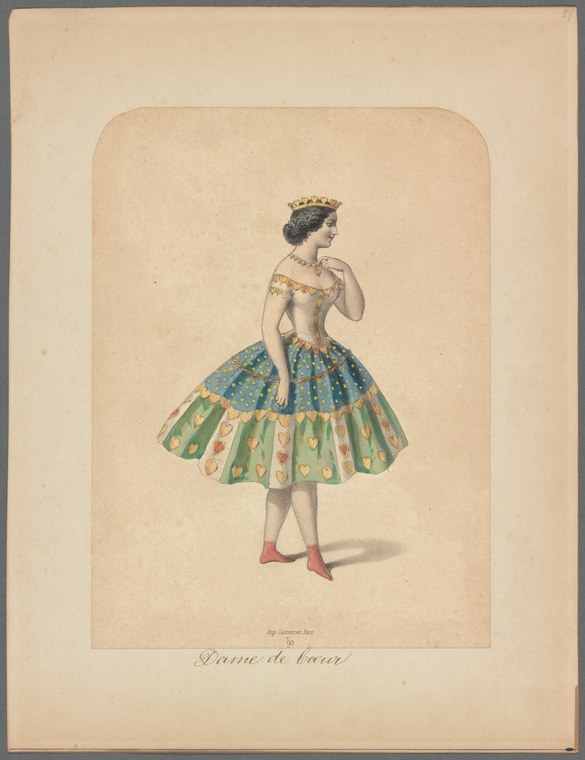 A woman in a jeweled crown and elaborate teal and green constructed skirt stands in balletic stance, left arm raised.