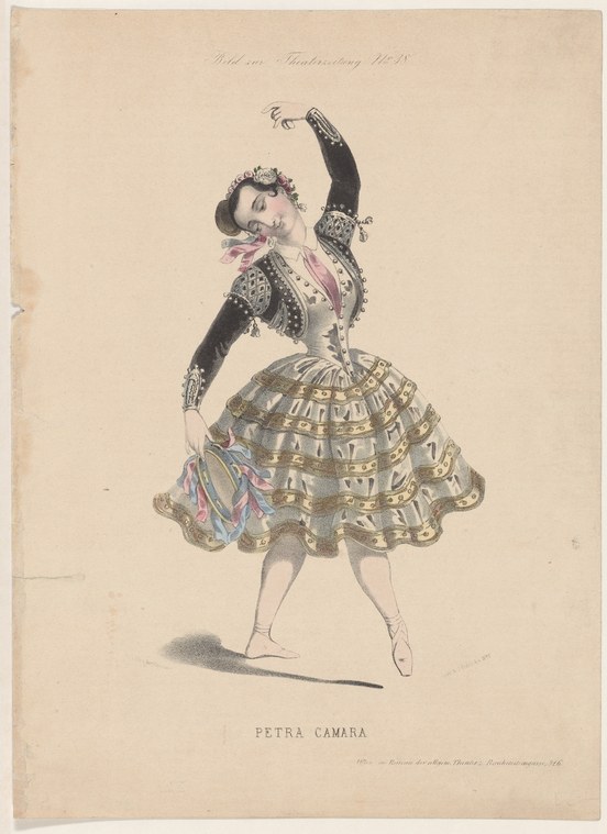 A female ballet dancer in black jacket and patterned gathered skirt, posed with one arm raised and gaze upward, mid-nineteenth-century colored print.