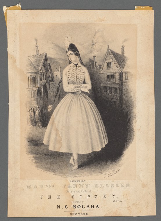 A young woman in 1840s Romantic ballet costume with corseted bodice, full skirt, and plumed headdress stands in a composed pose against an architectural