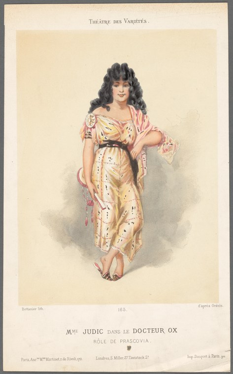 A woman in an 1880s pink blouse and yellow patterned skirt stands in a three-quarter pose, one arm raised gracefully.
