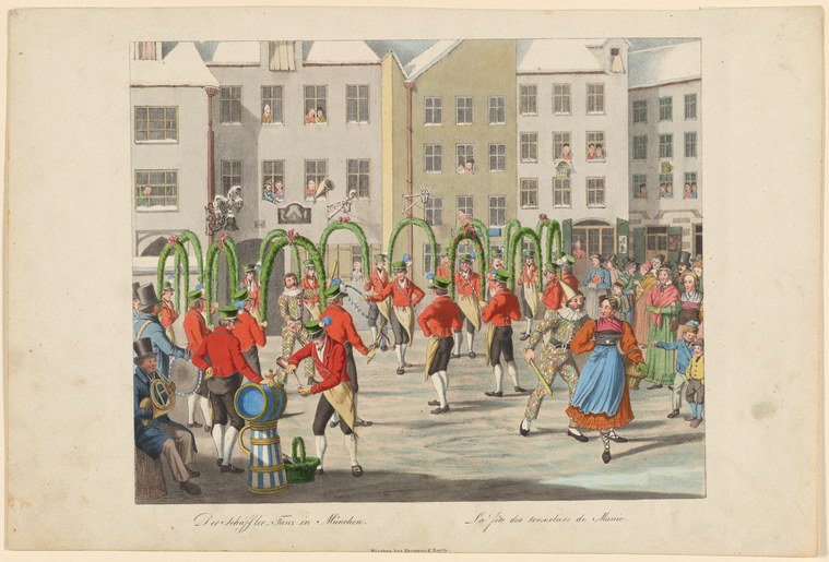 Dozens of figures in red jackets perform in a Munich town square surrounded by buildings and spectators, with a green arbor in the center.