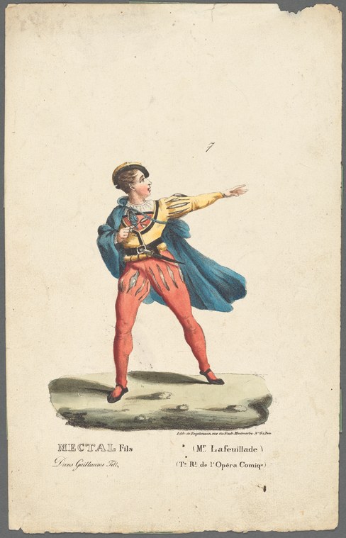 A young male dancer in blue military jacket and red tights extends his right arm while arching backward on a stage, his blue cape sweeping behind him.