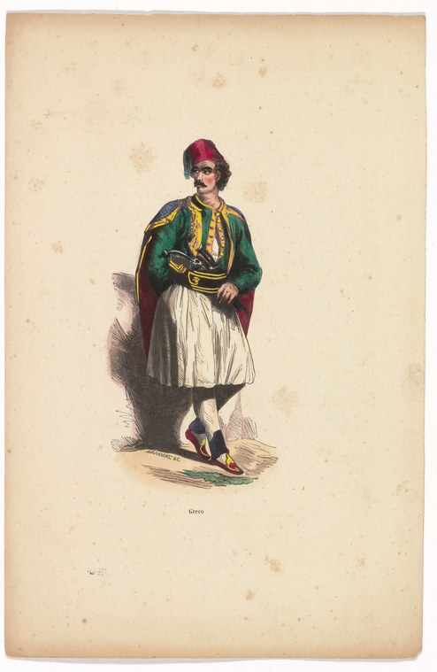 Man in crimson fez, green cape, and white pleated skirt stands in formal pose against plain background.