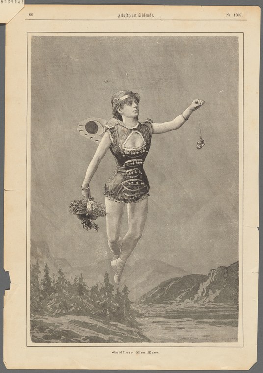 A female ballet dancer in a beaded tunic floats above a mountain landscape, arms extended in an open pose, holding a flower wreath.